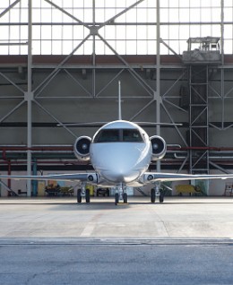 Business jet airplane in hangar